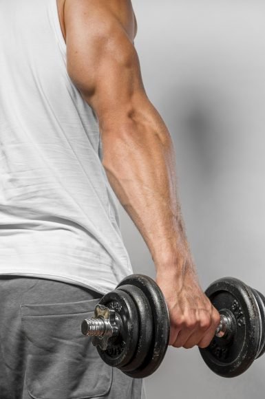 back-view-very-fit-man-holding-weight